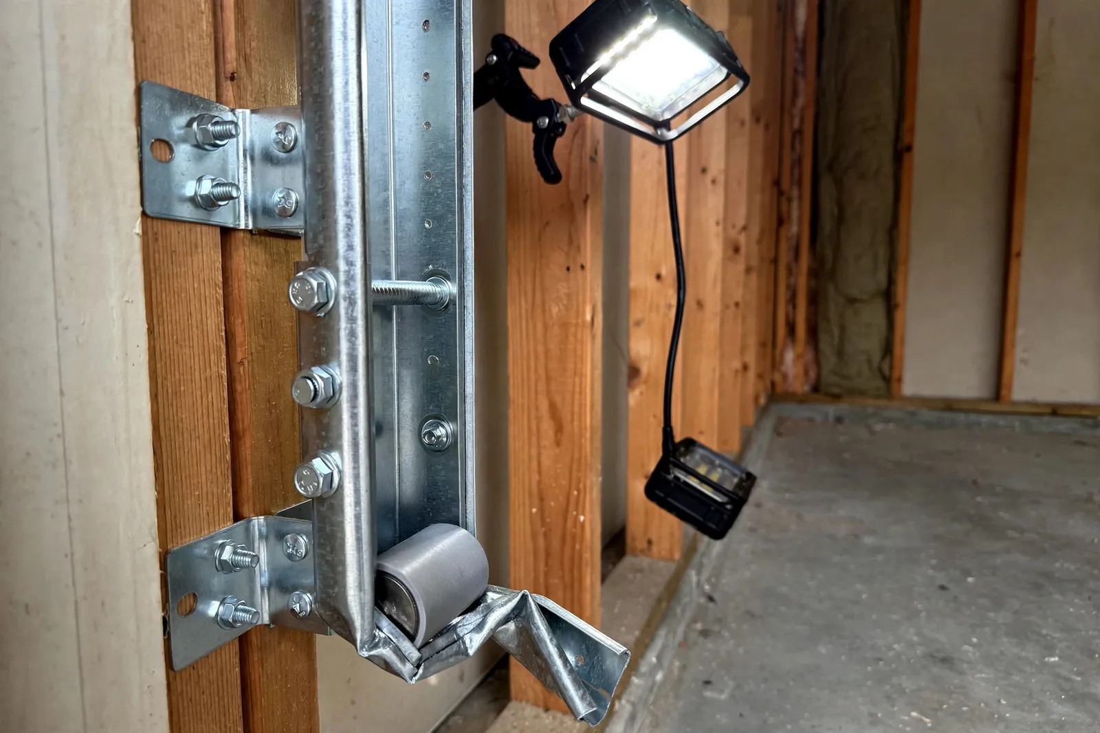 Before photo, Clipped Track Repair in Wakefield, by Waldorf Garage Door Repair